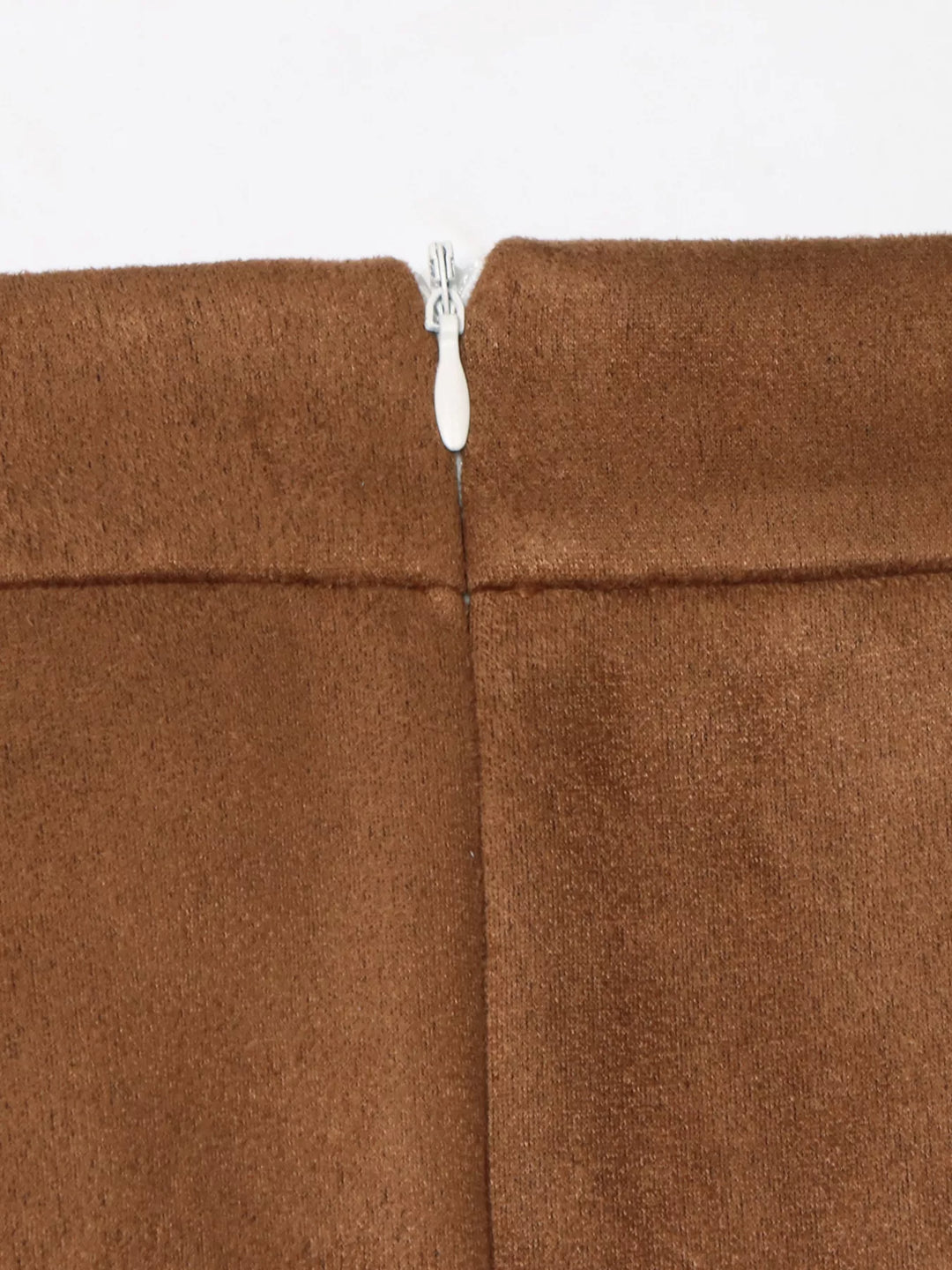 Close-up of the back zipper closure on the camel brown skirt