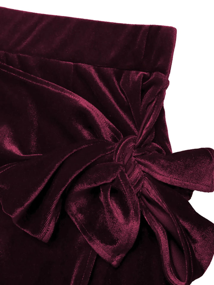 Close-up of the burgundy skirt bow tie waist detail