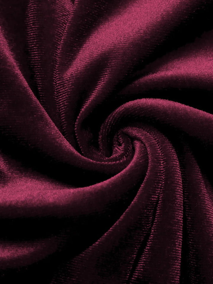 Close-up of the soft burgundy velvet-look fabric swirled in folds