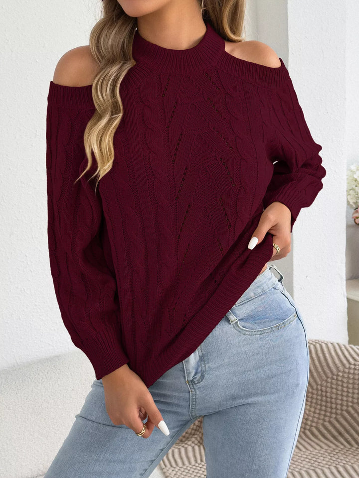Burgundy cold shoulder sweater worn with light wash jeans