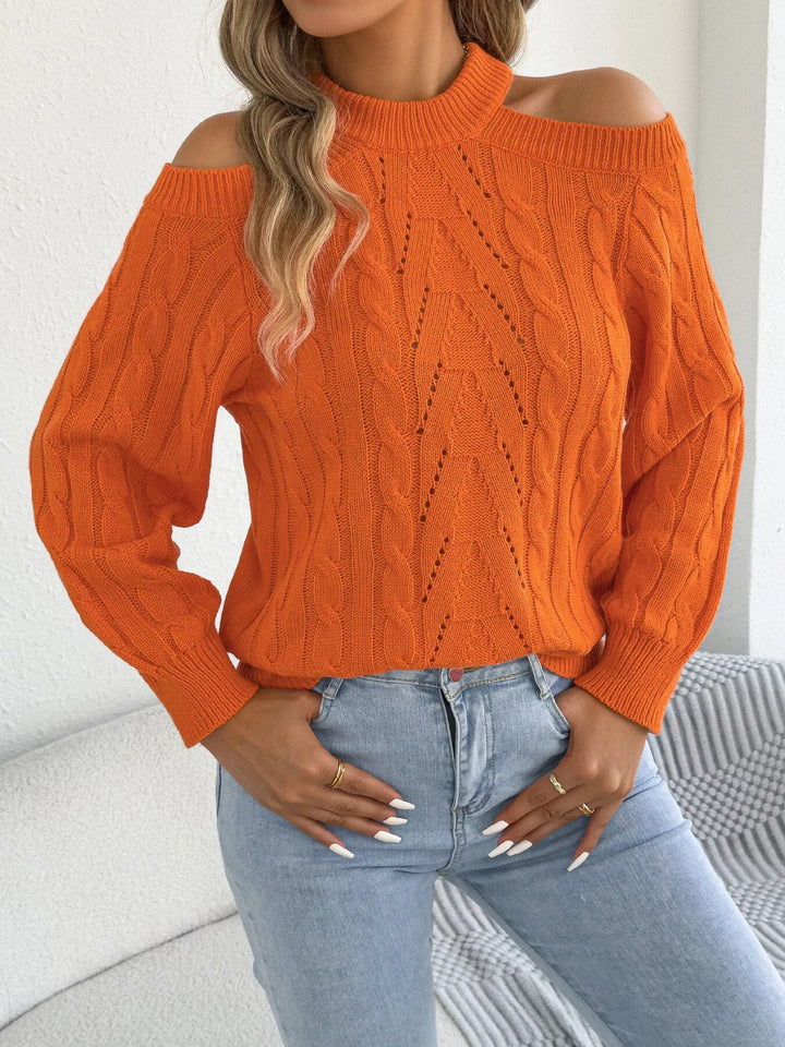 Close-up of the orange mock neck sweater pointelle cable pattern