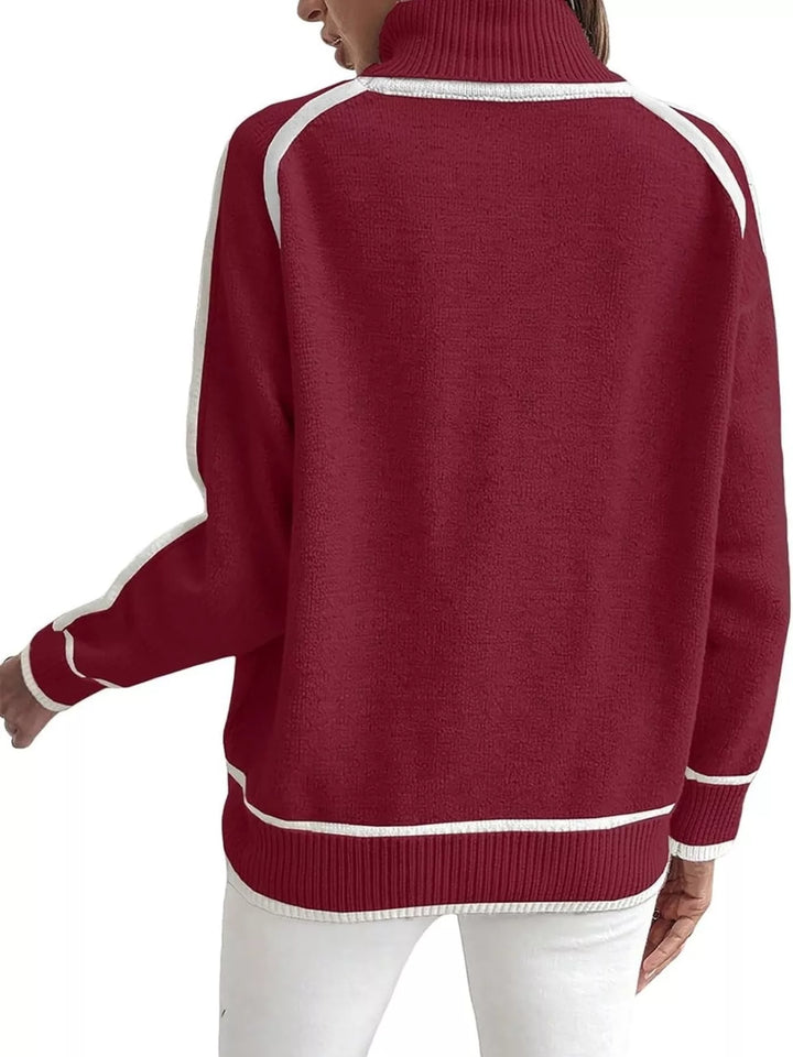 Red mock neck sweater with white piped hem, back view