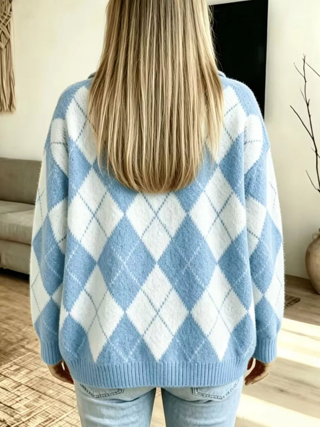 Back view of the light blue argyle sweater with straight hair