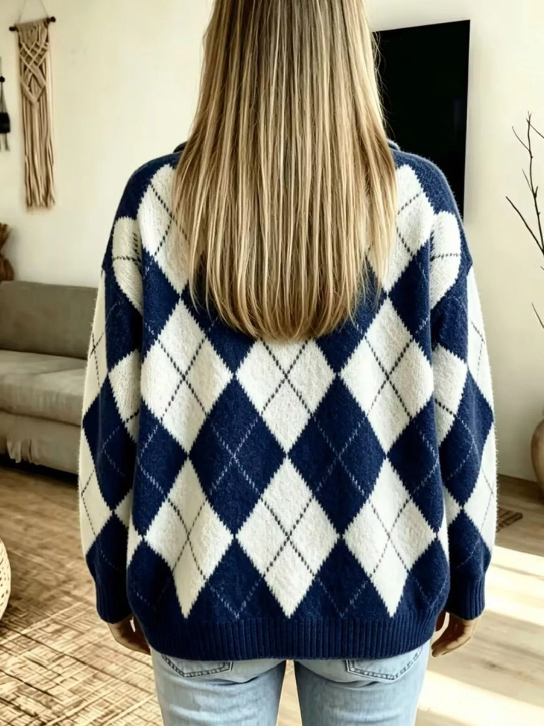Back view of the navy oversized argyle sweater