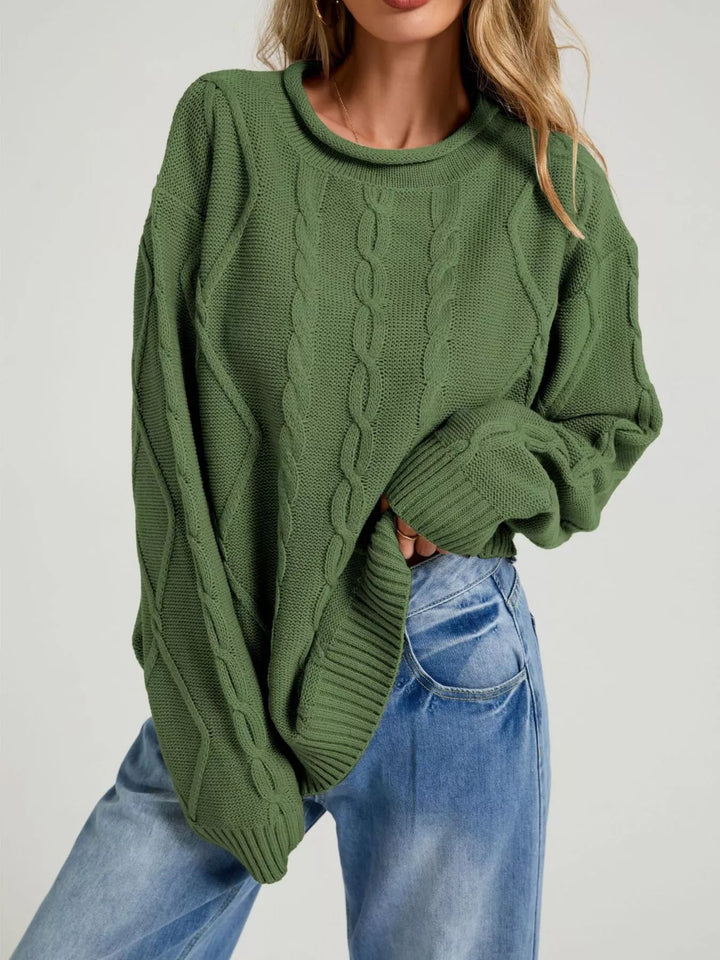Forest green oversized cable knit sweater with rolled neck, front view