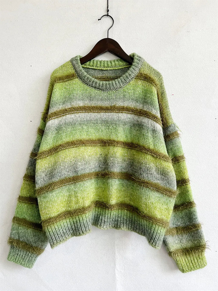 Green striped round neck sweater hanging on a hanger