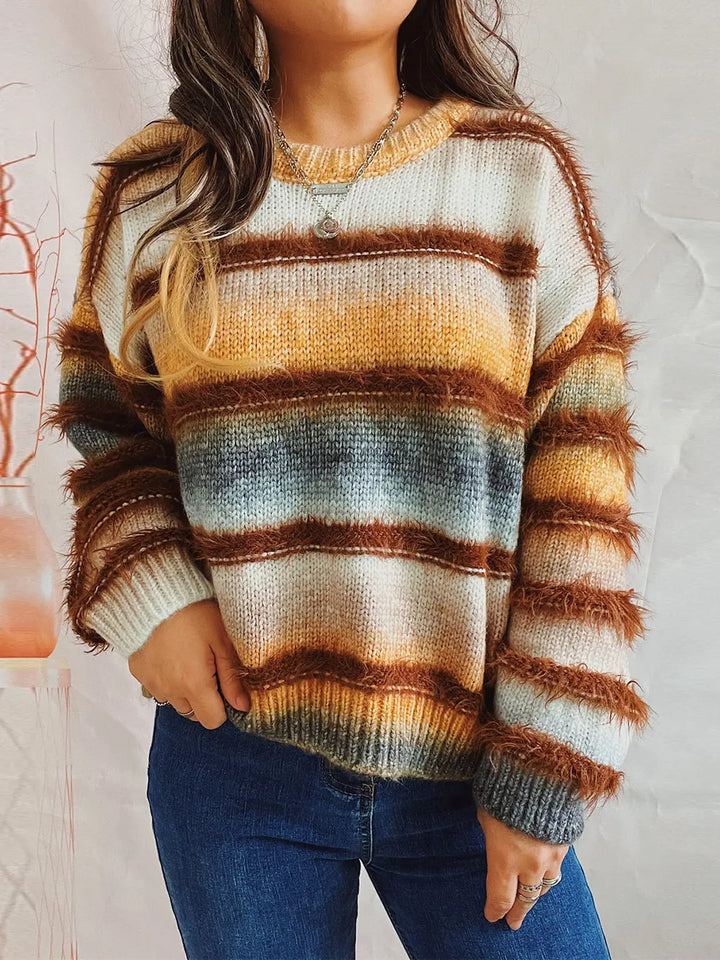 Ochre fuzzy striped oversized sweater worn with jeans, front view