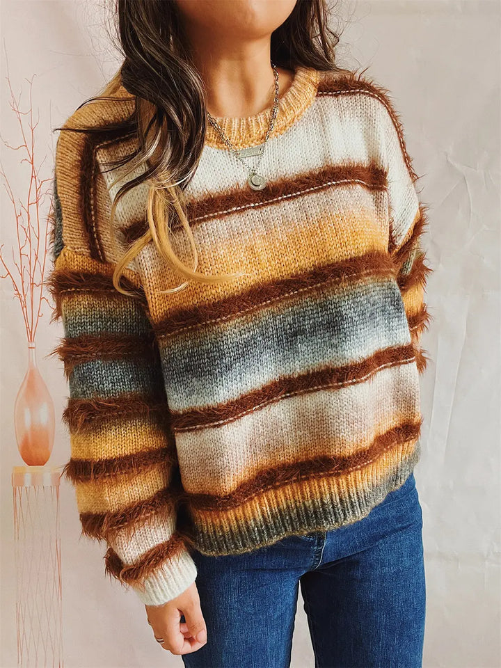 Ochre striped sweater with a fuzzy texture, model with a hand in the pocket