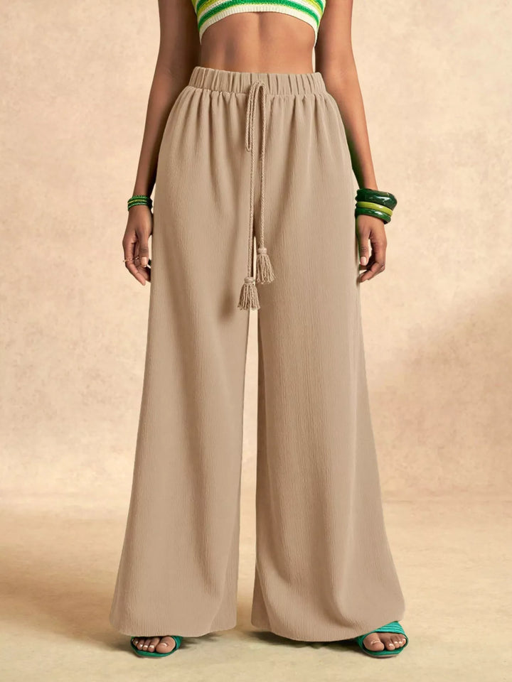 Beige extra wide pants, front view of the drawstring waistband