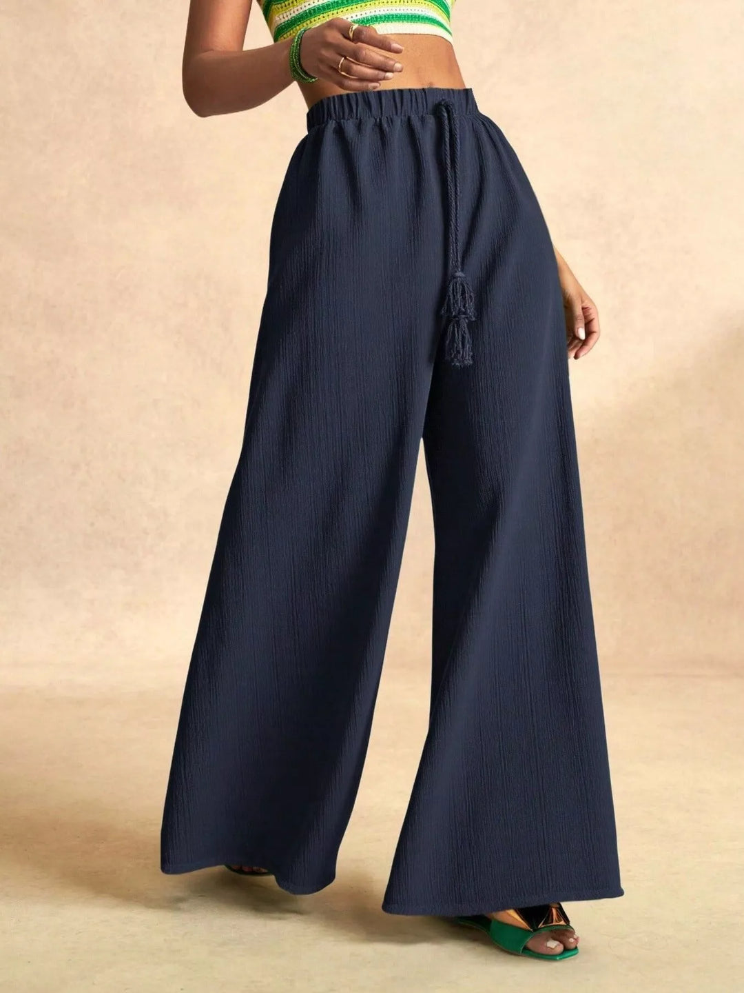 Navy palazzo pants with an extra wide flowy leg and tassel tie