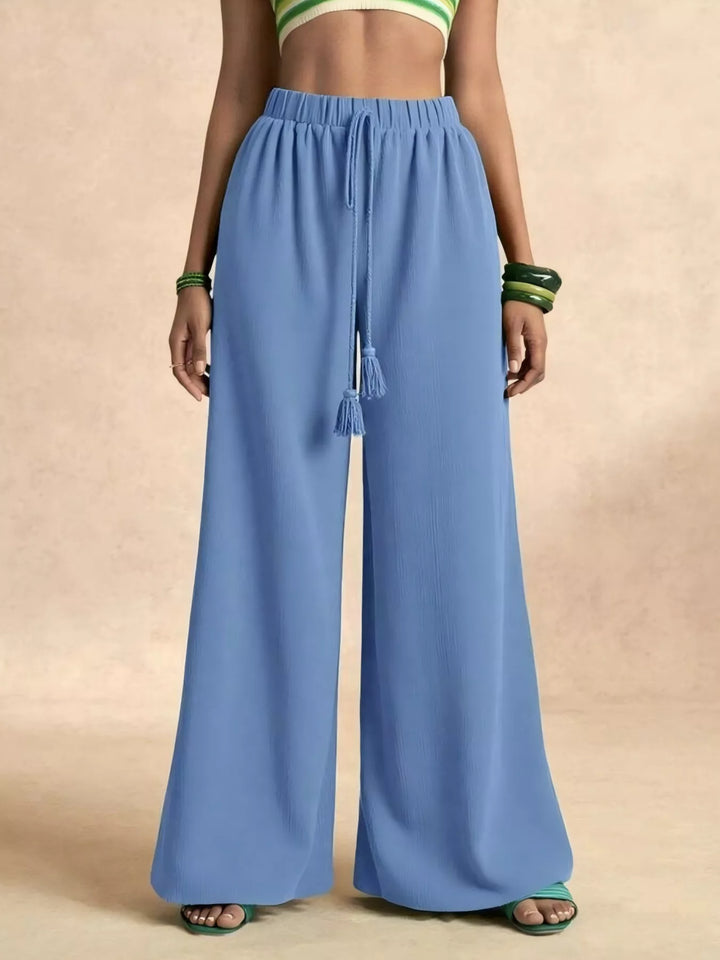 Sky blue palazzo pants, waist view showing the tassel drawstring