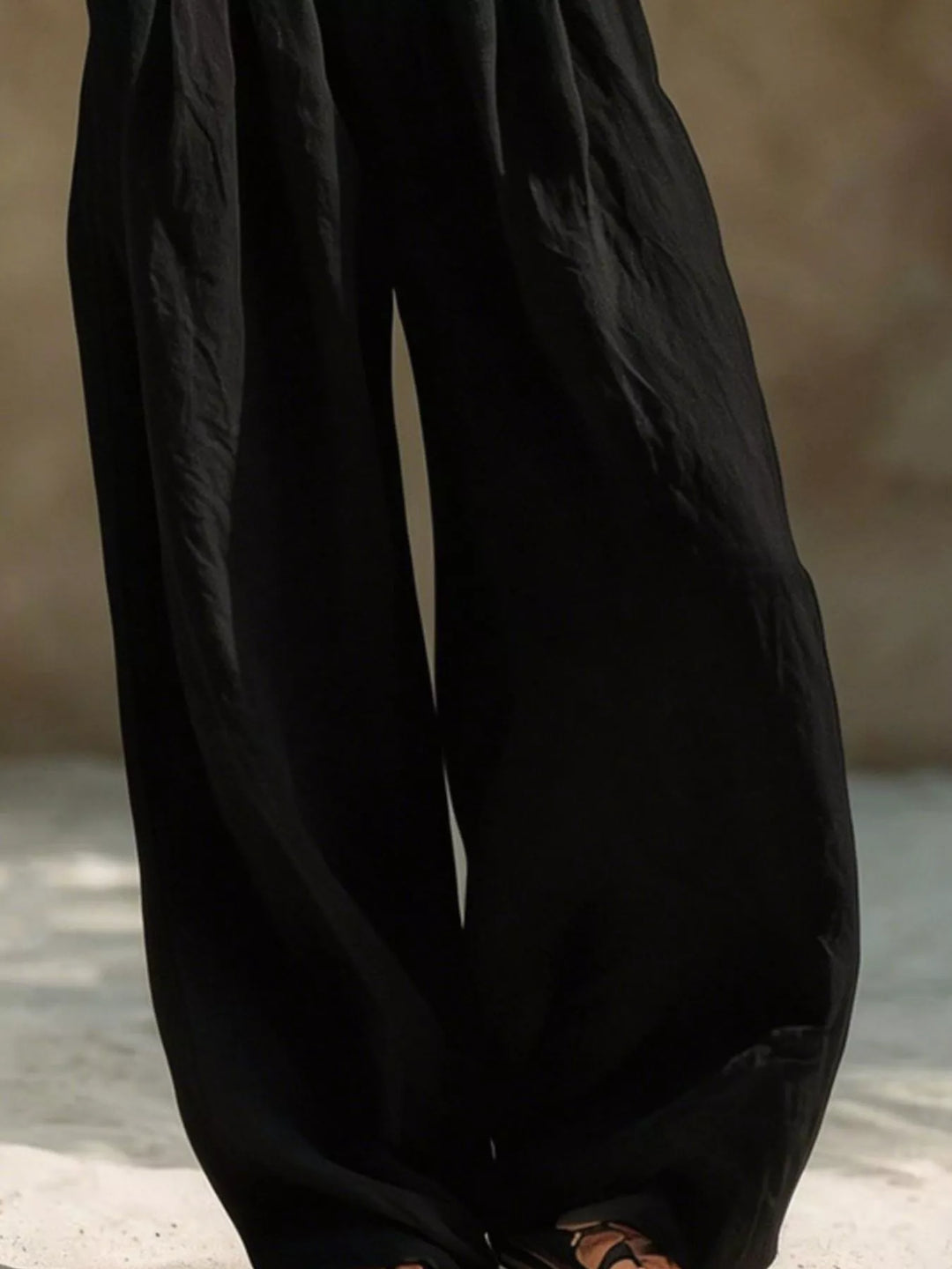 Black extra wide leg palazzo pants detail of the loose flowing legs