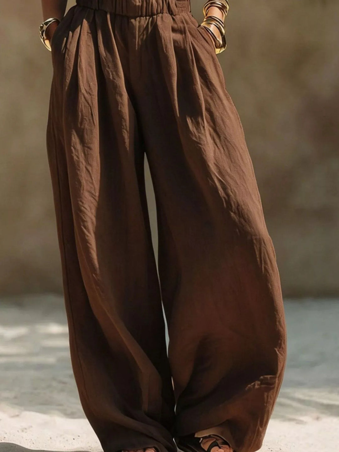 Chocolate brown wide leg pants with a loose drape, shown from the front