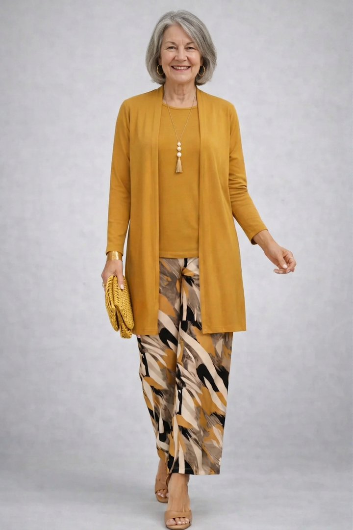 Women's pant suit in mustard with a long open cardigan and abstract print wide leg pants