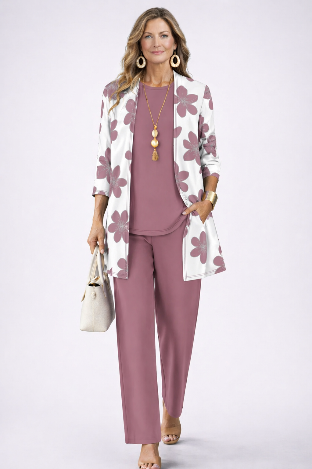 Women's pant suit in mauve with a white daisy print cardigan, curved hem top and straight pants