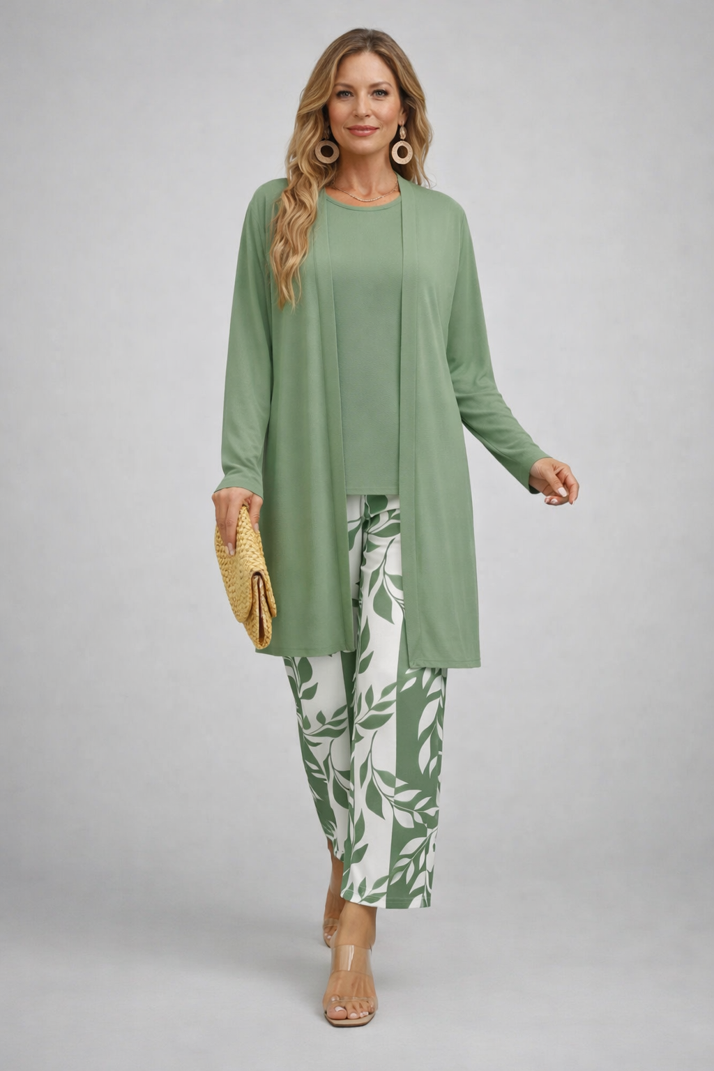 Women's pant suit in sage green with a longline open cardigan and foliage print cropped pants