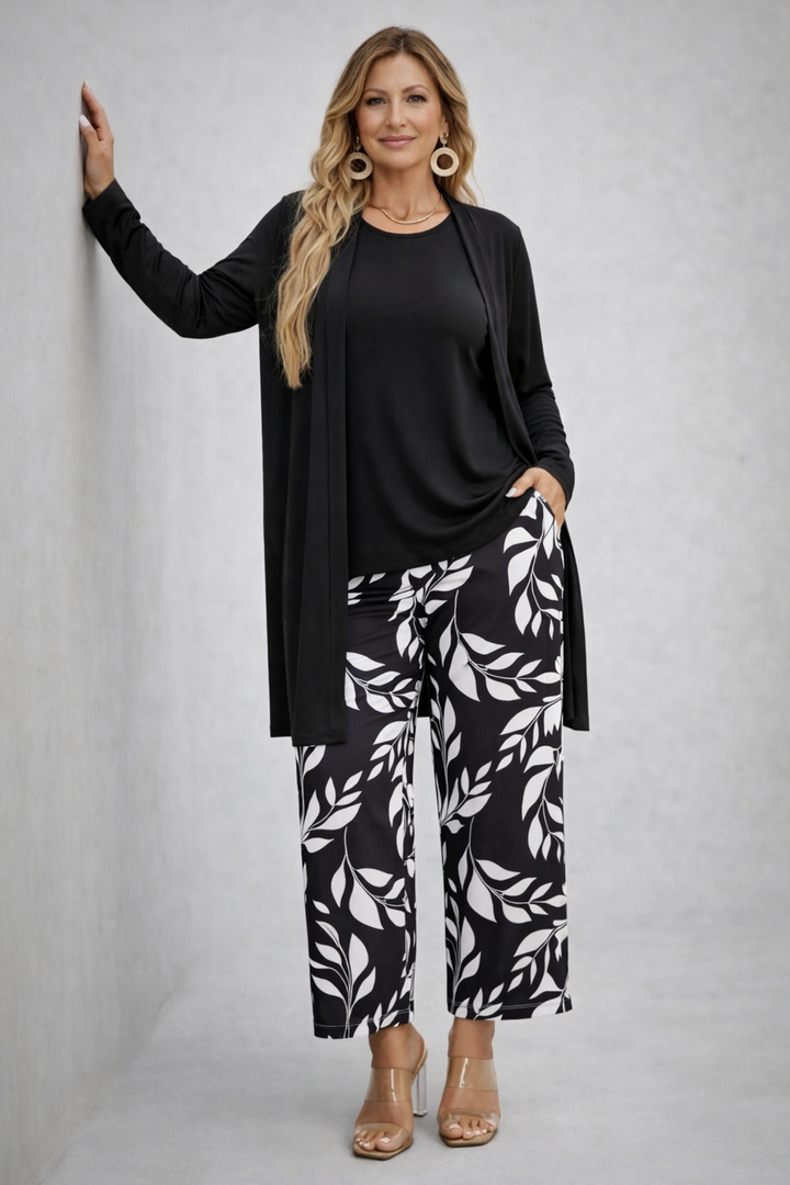 Women's pant suit in black with a long open cardigan and white laurel leaf print wide pants