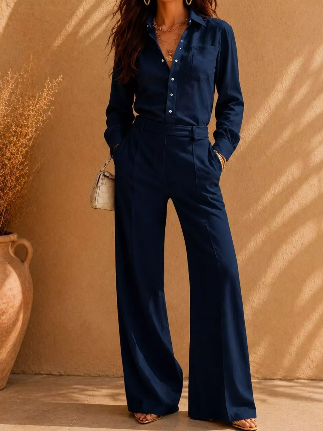 Navy button front shirt paired with matching high waist wide pants