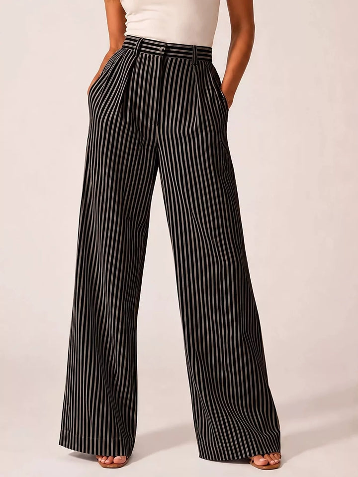 Women's black pinstripe pants, high waisted wide leg pleated style, front view