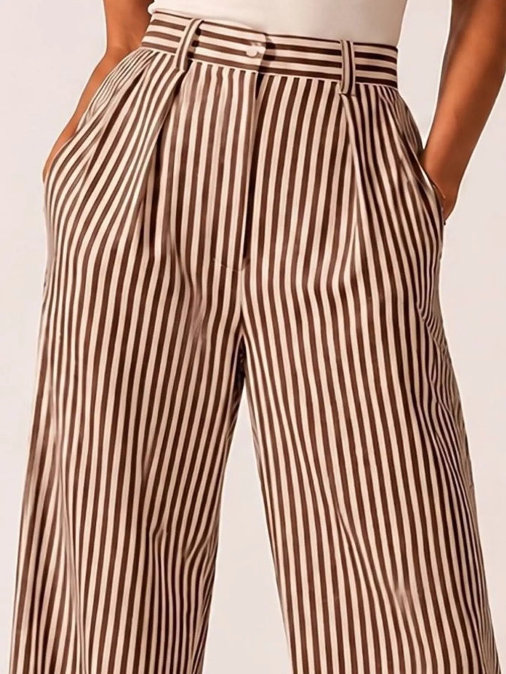 Brown pinstripe high waisted pants, close view of the pleats and stripes