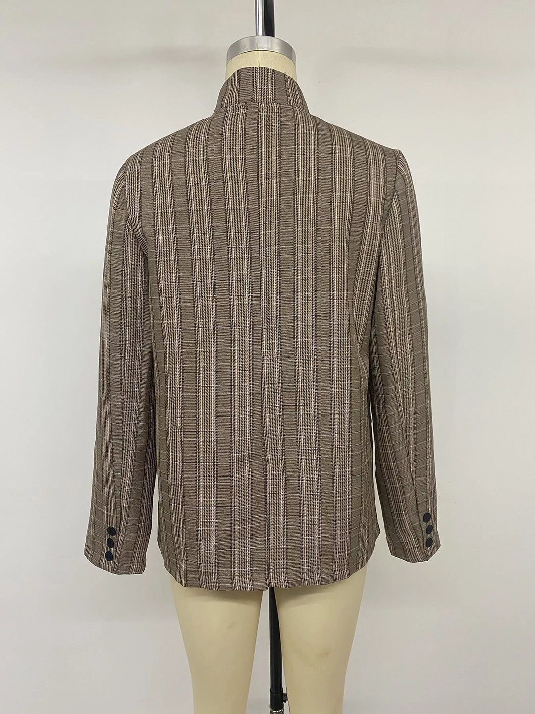 Back view of the mocha plaid blazer on a mannequin with button cuffs