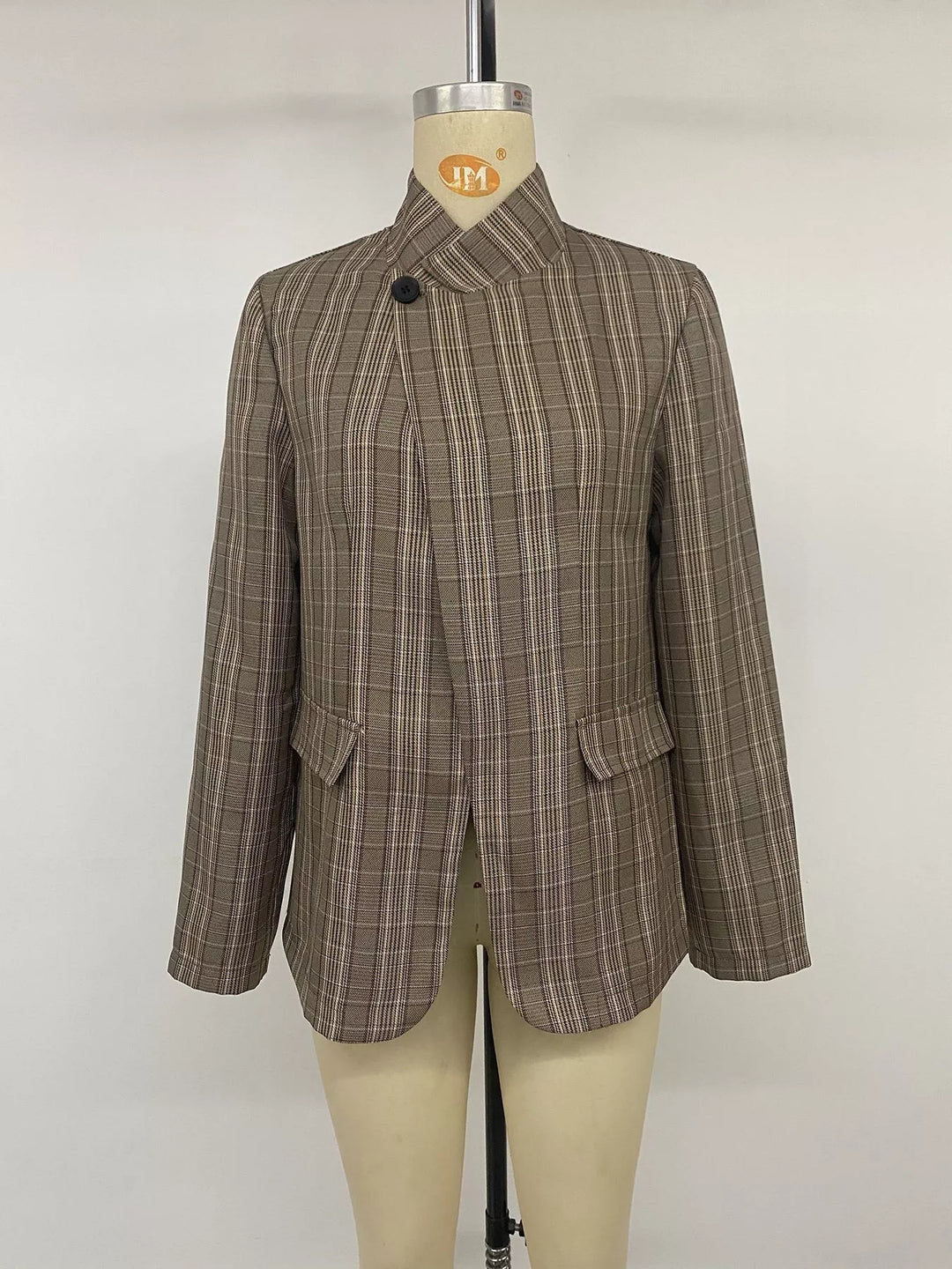 Mocha plaid blazer front view on a mannequin with flap pockets
