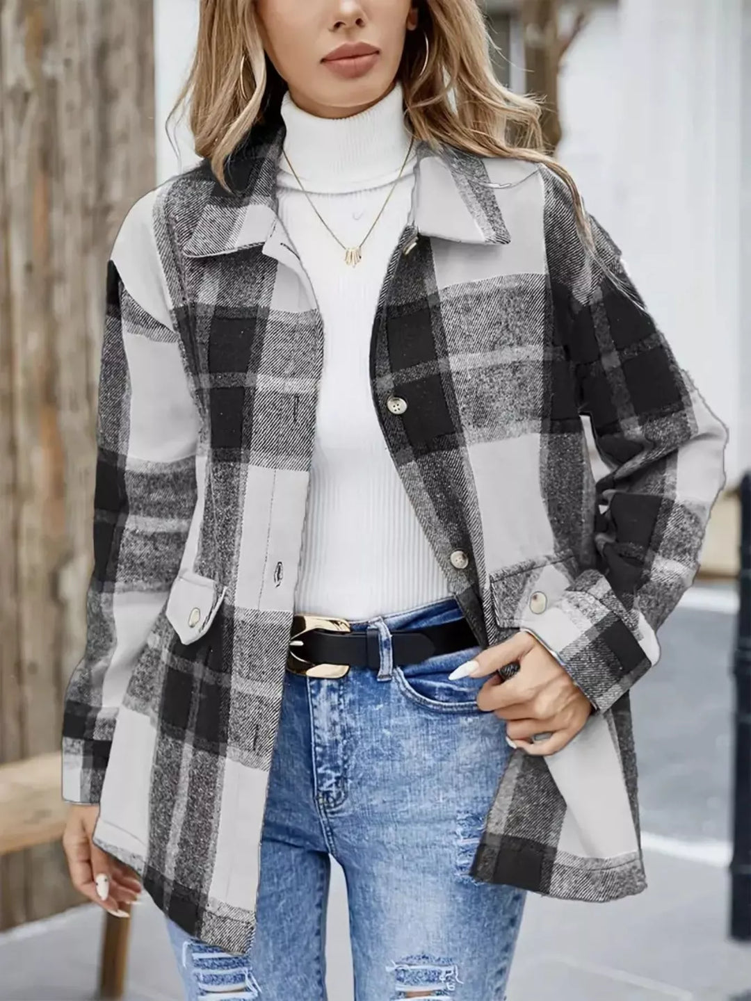 Black plaid shacket with collared button front, worn with a white top and jeans