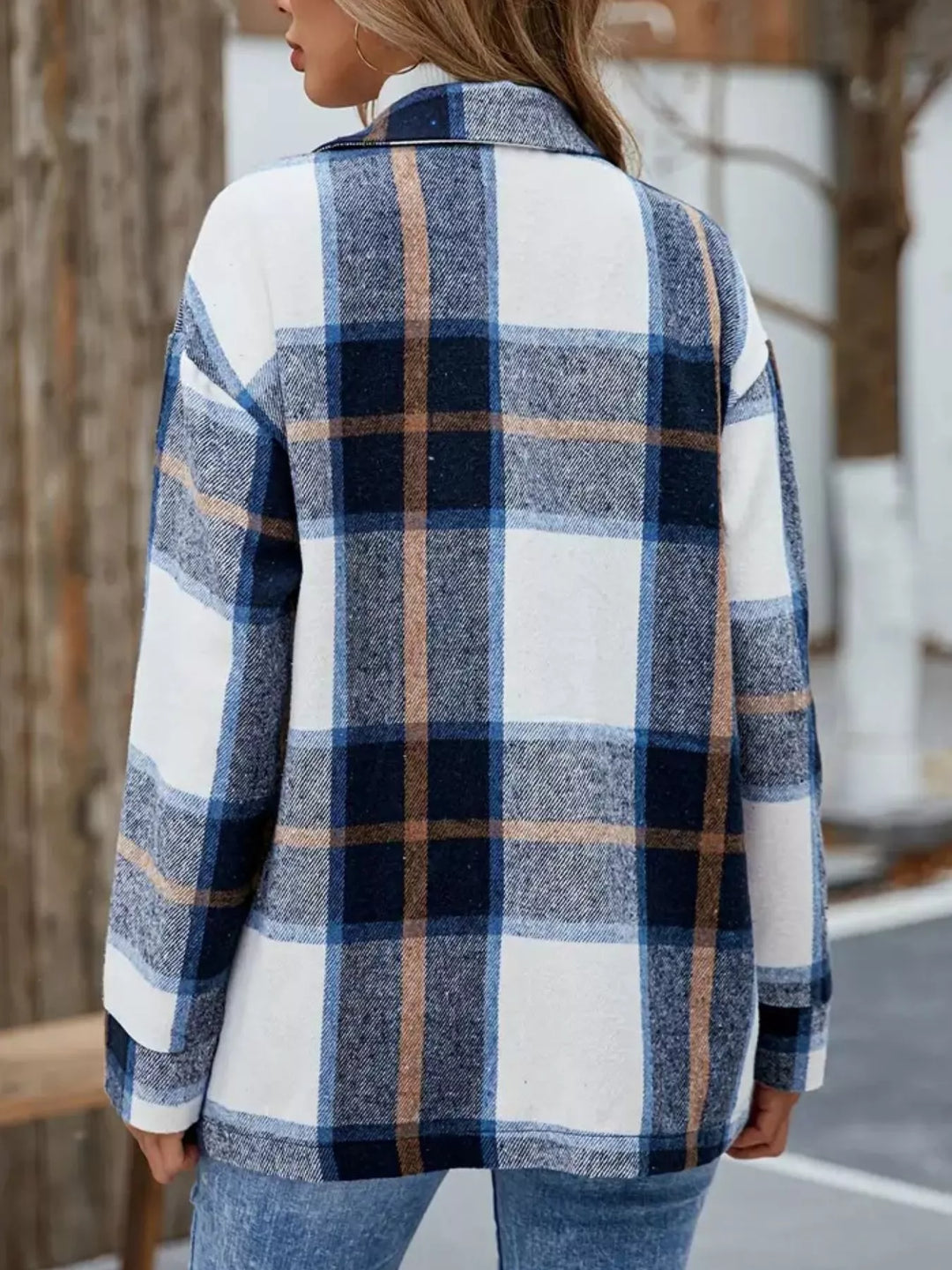 Back view of the navy plaid shacket showing the large check pattern