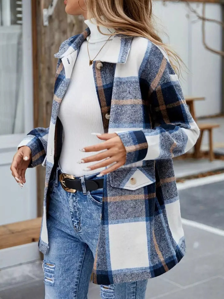 Three quarter side view of the navy plaid shacket with a belted waist
