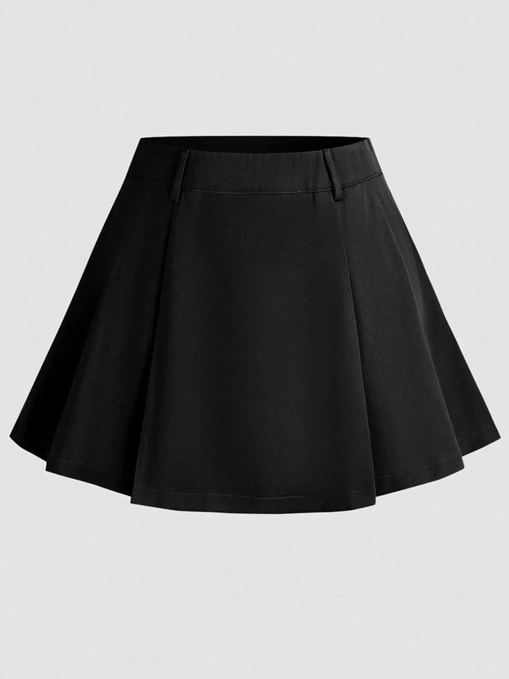Black pleated mini skirt with flat waistband, front view on light gray