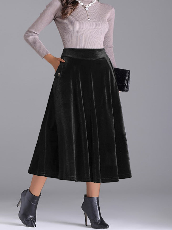 Women's black pleated skirt, velvet-look high waist A line midi, with ankle boots