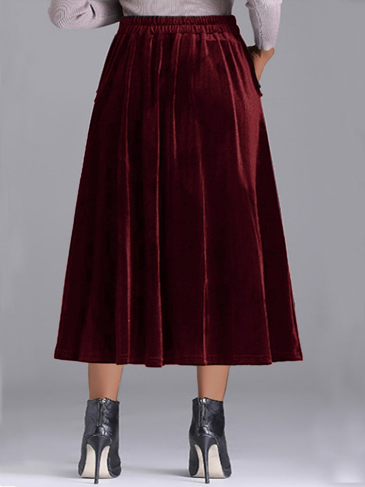 Back view of the burgundy velvet-look pleated skirt