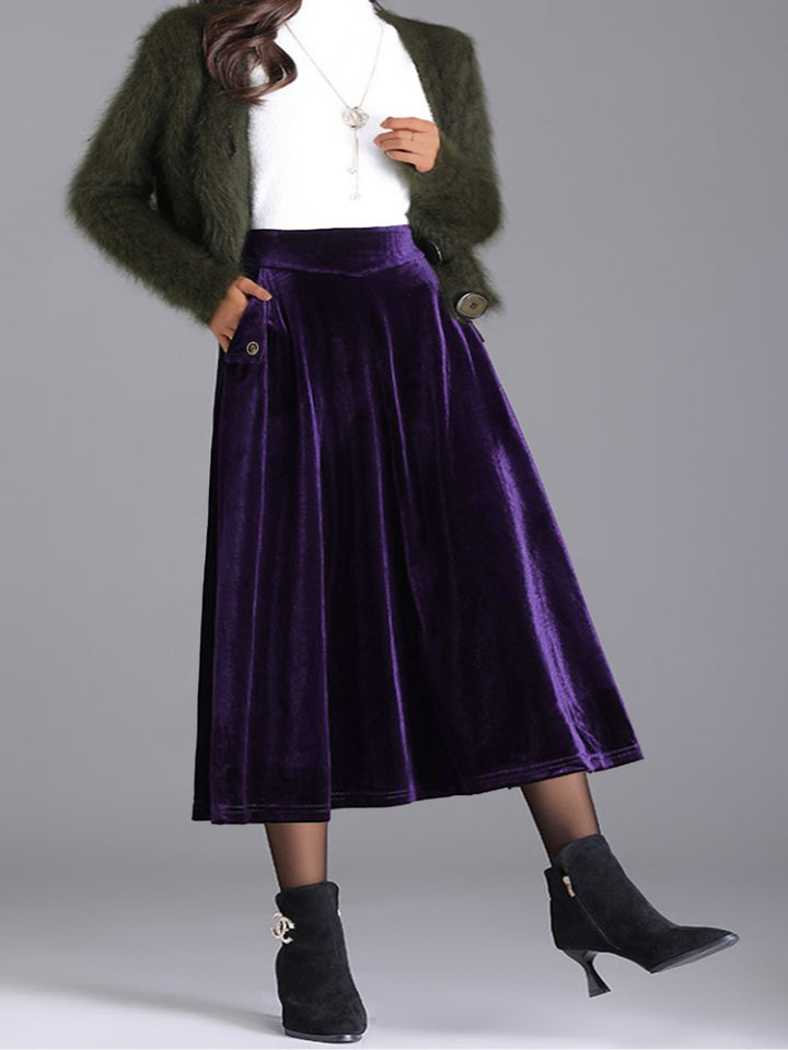 Deep purple A line midi skirt with a white top and black boots, front view