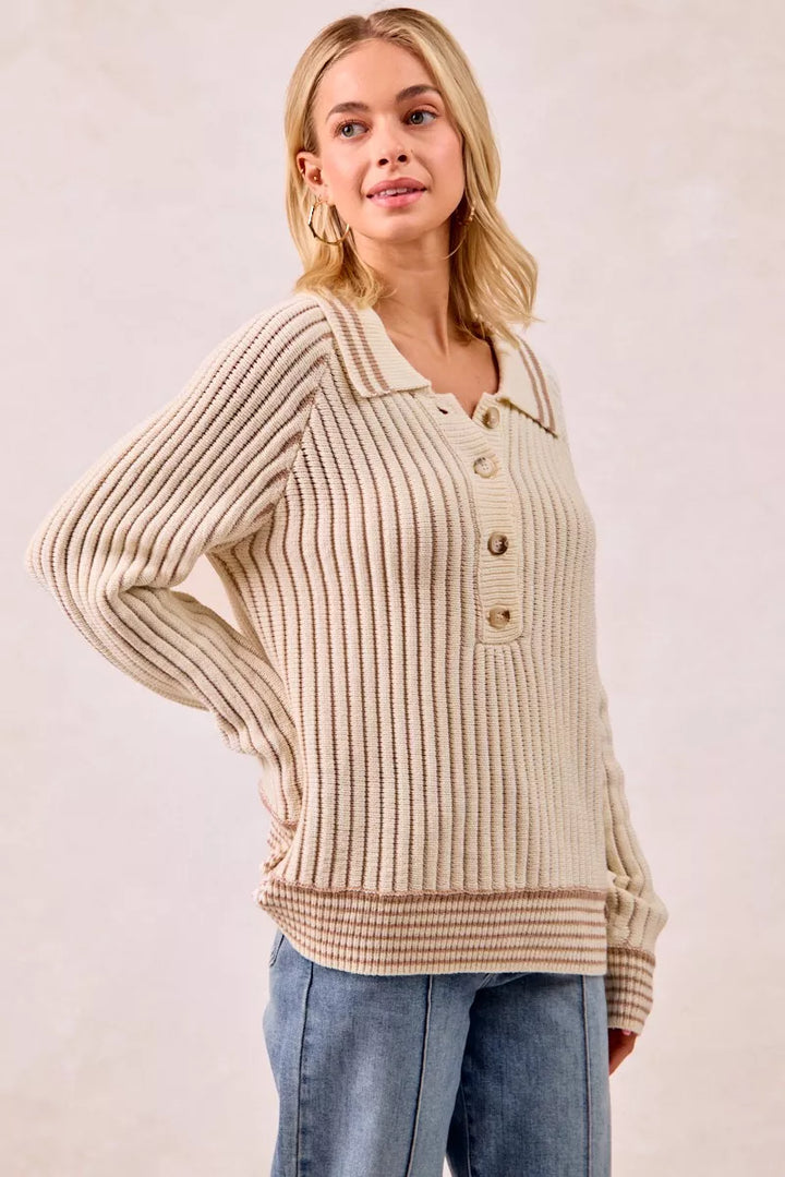 Cream latte ribbed sweater with stripe trim, leaning pose with hand on hip