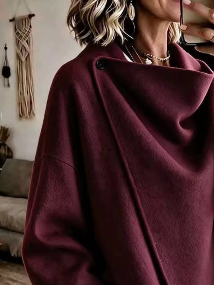 Asymmetric cowl neck draped plus size in burgundy, close-up detail