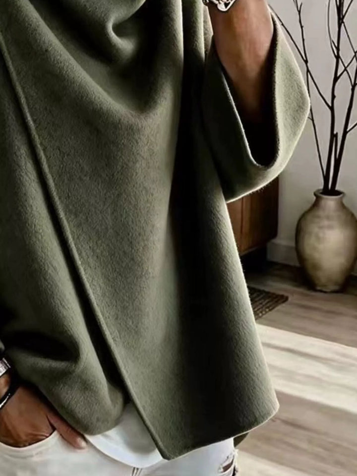 Asymmetric cowl neck draped plus size in green, close-up detail