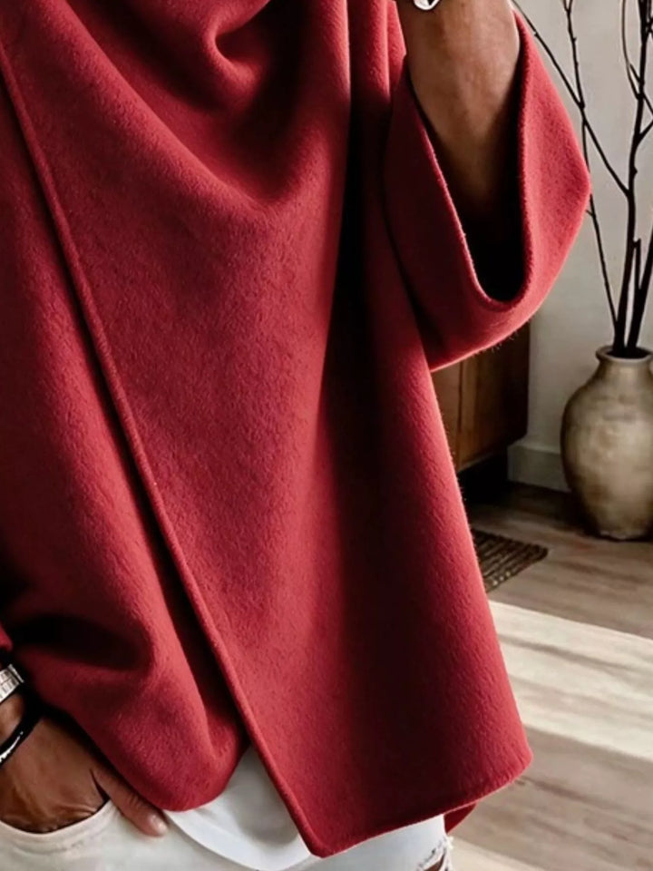 Asymmetric cowl neck draped plus size in red, close-up detail