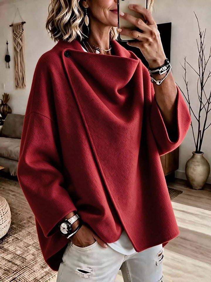 Asymmetric cowl neck draped plus size in red, front view