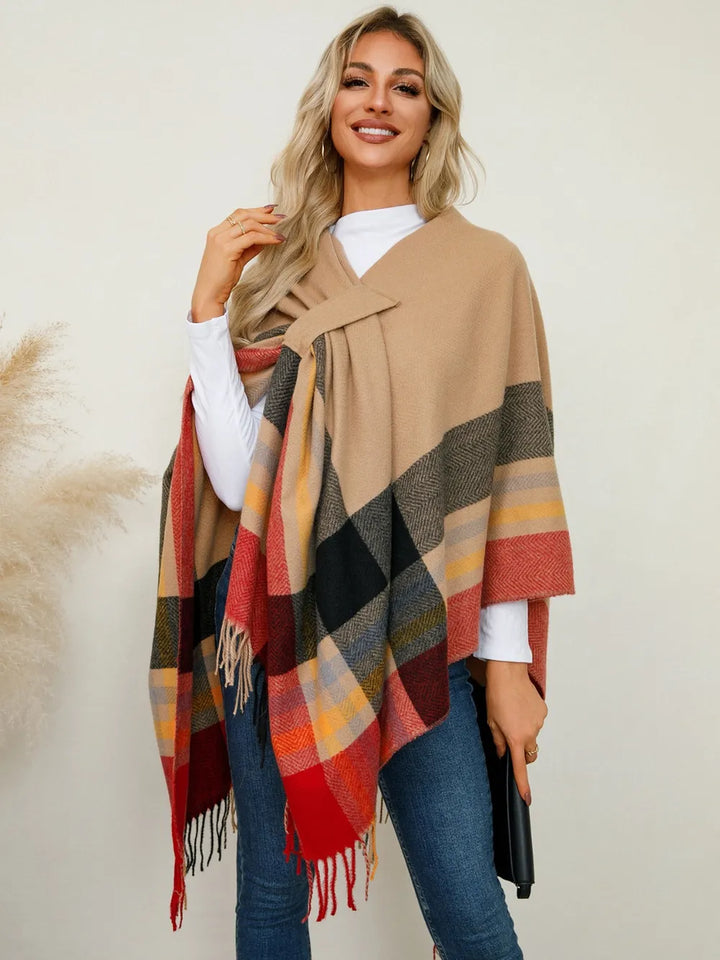 Women's poncho sweater in sherbet, plaid fringe hem open front