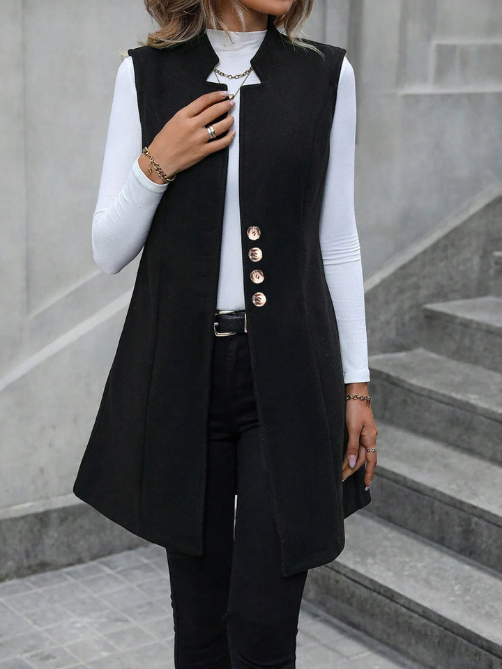 Longline stand collar button side pockets in black, back view