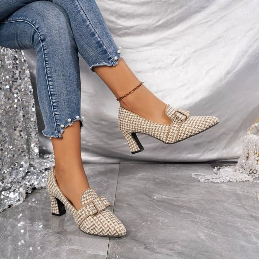 Beige houndstooth block heel pump with buckle, seated side angle
