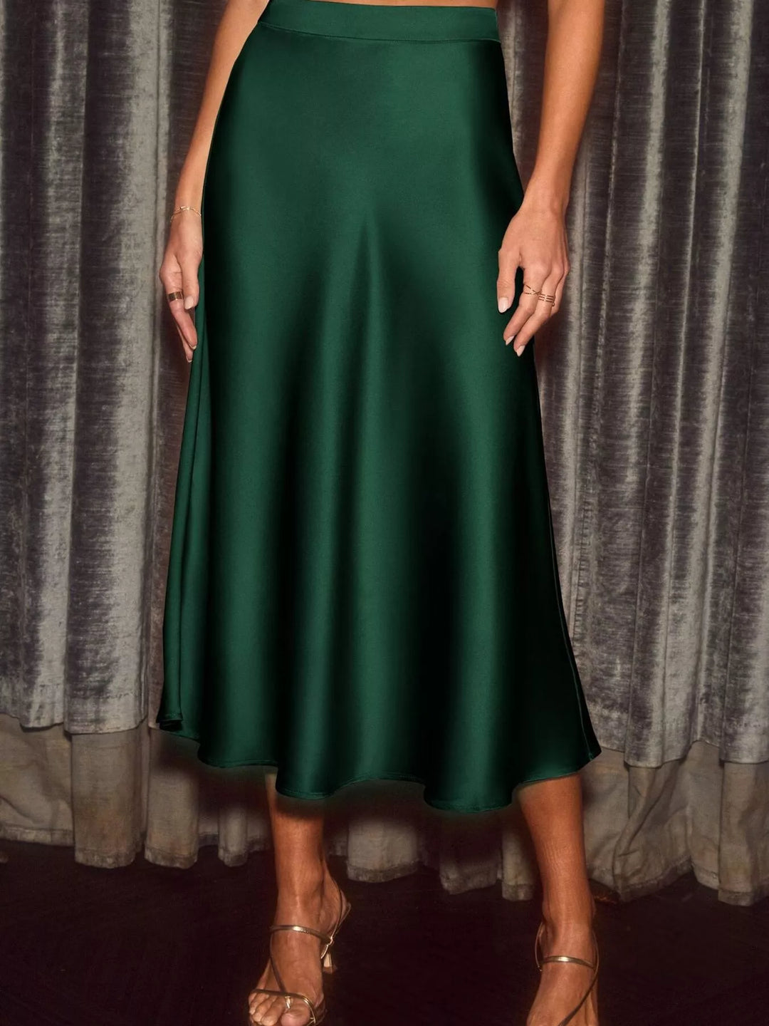 Emerald green high waisted skirt in full length with flowing movement