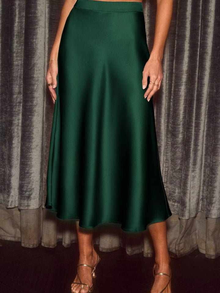 Emerald green high waisted skirt in full length with flowing movement