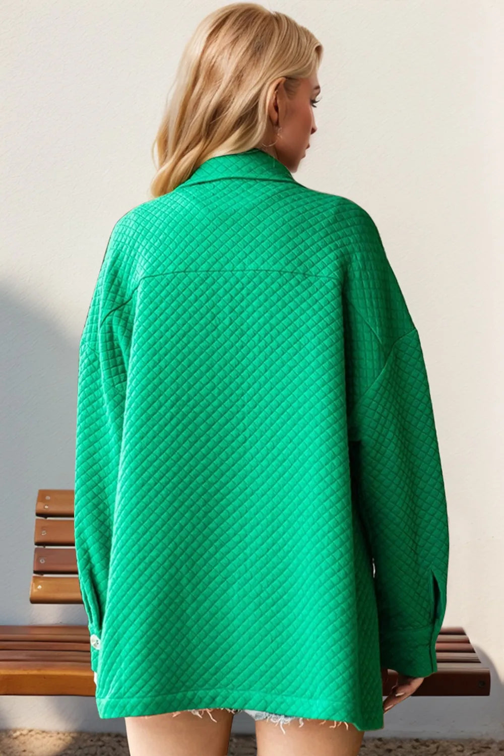 Back view of the oversized emerald green shacket with drop shoulders