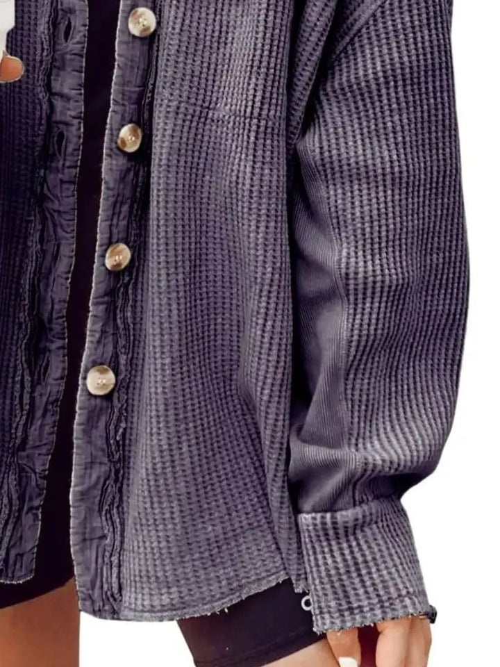 Charcoal shacket close-up showing the ribbed sleeve and button front