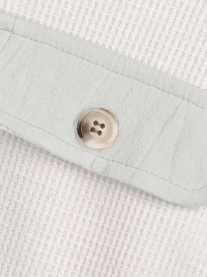 White shacket pocket flap and button detail on waffle knit fabric