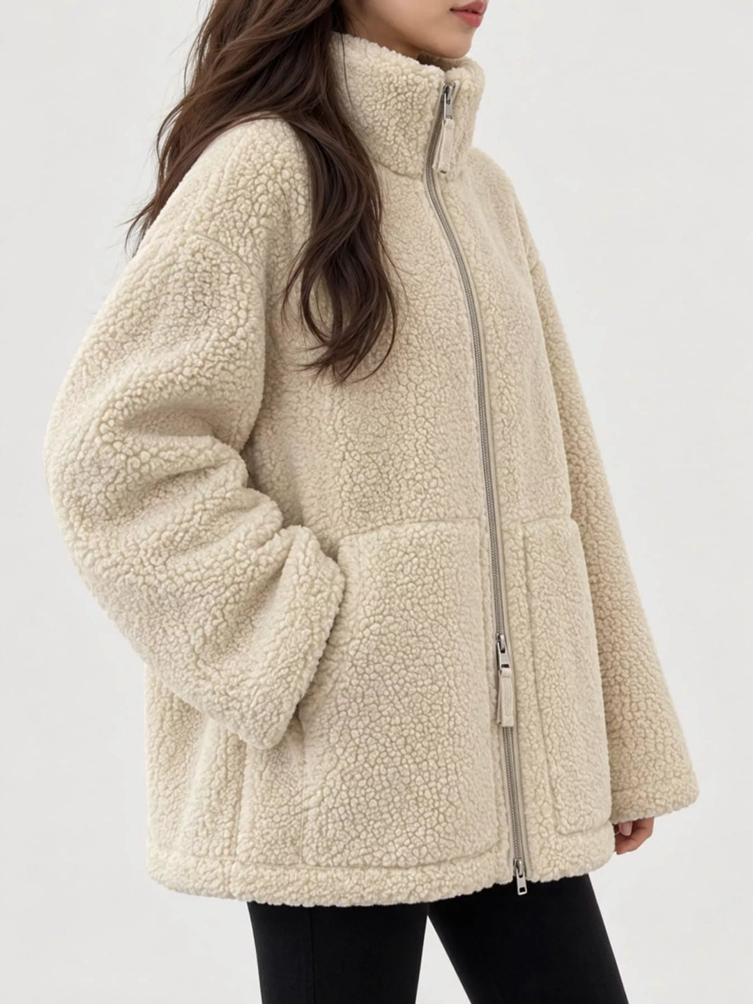 Stand collar full zip drawcord hem in off white, styled on model 2
