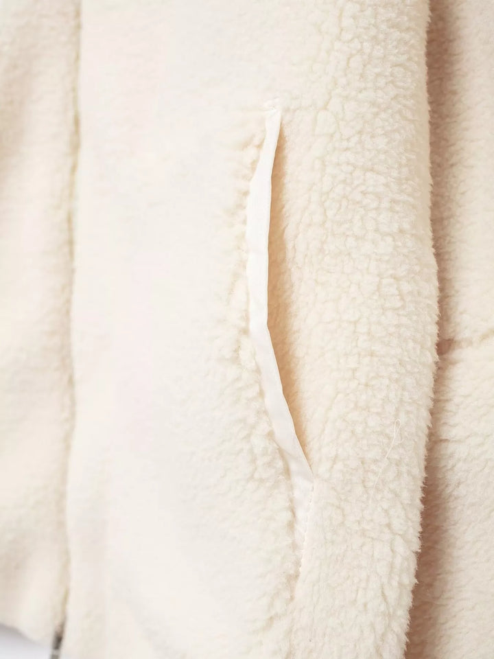 Stand collar full zip drawcord hem in off white-ribbed, close-up detail
