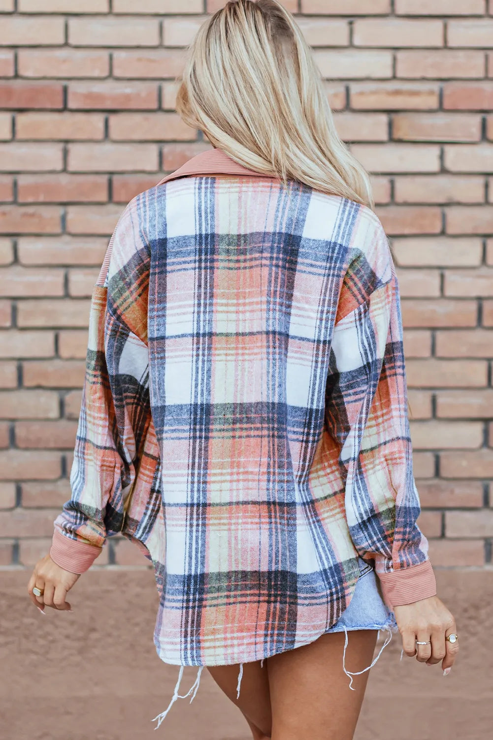 Back view of the blush plaid shacket with a relaxed oversized fit