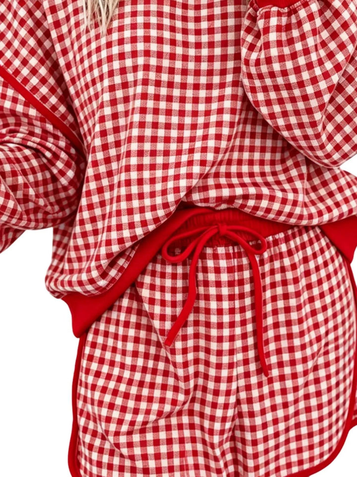 Close-up of the red gingham drawstring waist and contrast trim on the shorts
